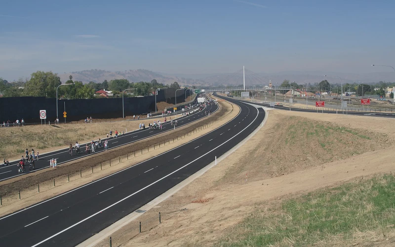 A regional highway in New South Wales curving towards distant hills